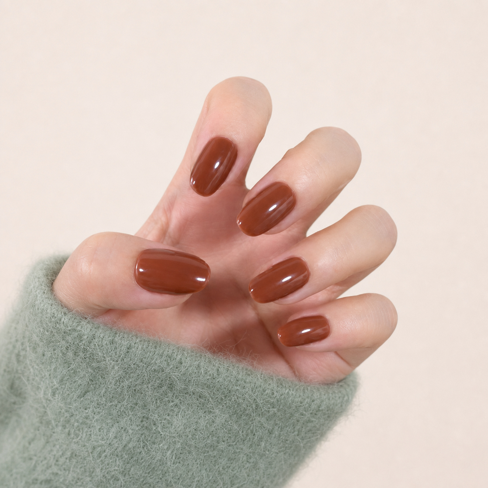 NAILINK Mocha press-on nails shown on a complete hand